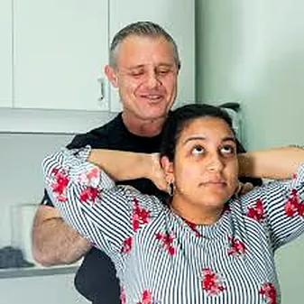 Assisted neck stretch at Manhattan Chiropractic Health Services